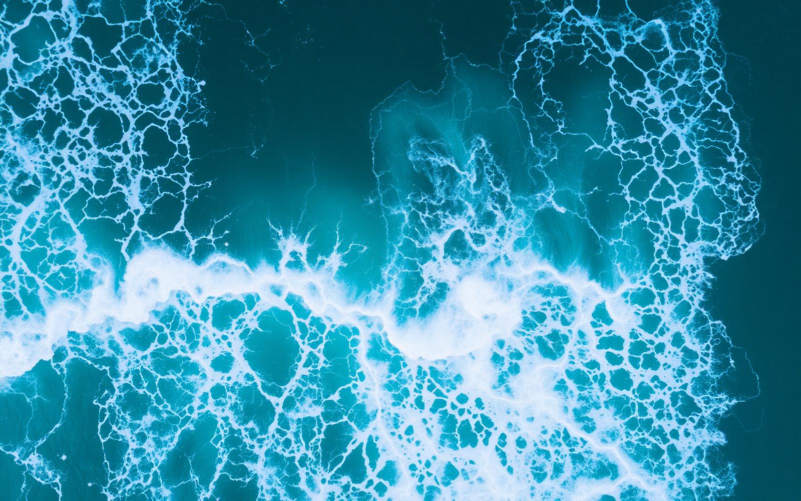 Aerial of breaking ocean foam